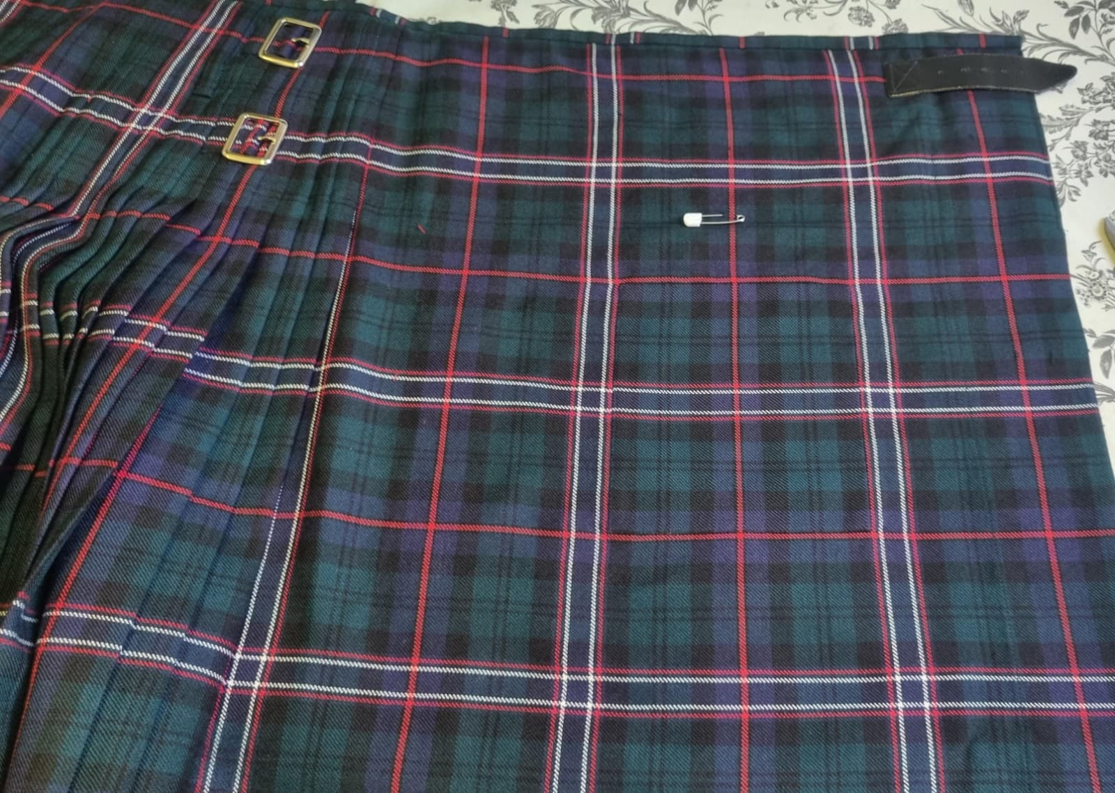 Black Watch tartan kilt apron panel after invisible reweaving repair.